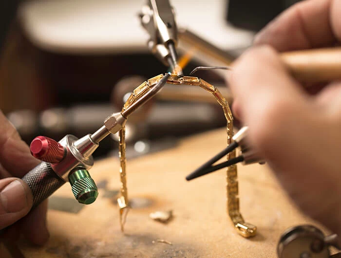 Susie's Jewelry Repair a person working on a piece of jewelry